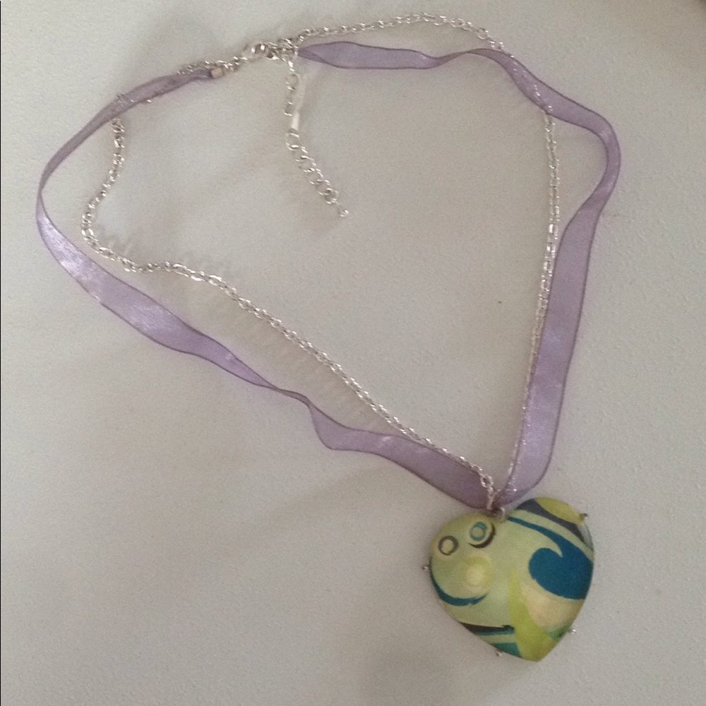 Necklace a Dangling Heart on a Ribboned Chain